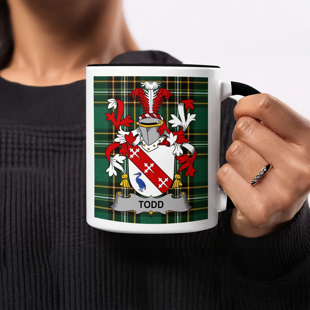 Mug featuring the Todd family crest on a green tartan background.