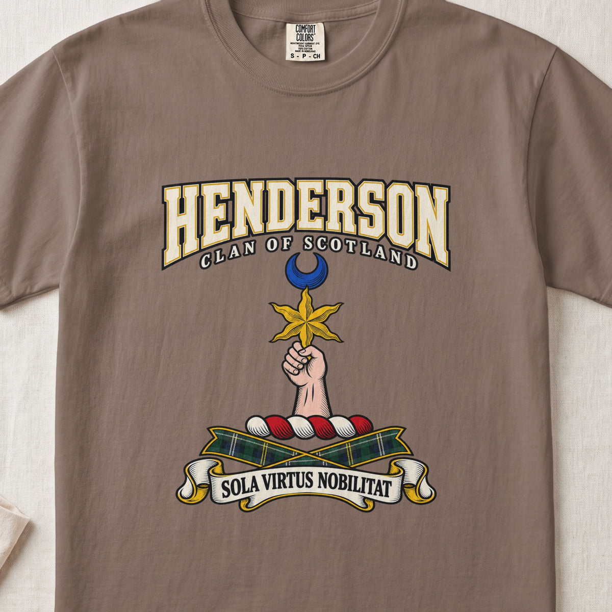Espresso Henderson Scottish clan T-shirt, front flat lay with varsity lettering, star-and-crescent crest and tartan ribbon.