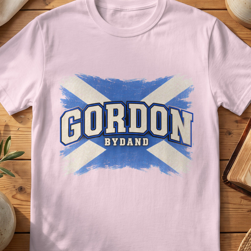 Gordon Scottish Saltire T-shirt in Light Pink, with distressed blue and cream flag and “Bydand” lettering.
