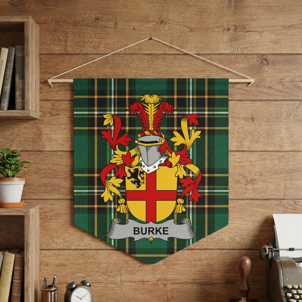 Burke surname emblem banner on green tartan fabric against wood paneling.