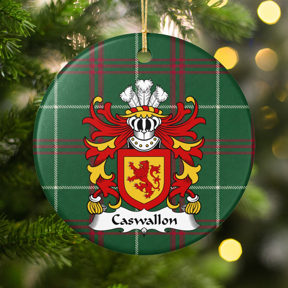 Caswallon ornament hanging among Christmas tree branches and warm lights; a red upright lion on a gold shield with a red border on Welsh national tartan.