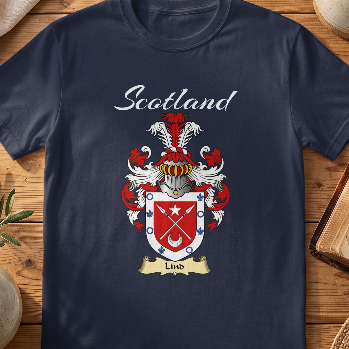 Navy Lind family shield T-shirt featuring crossed arrows and a crescent on a red shield
