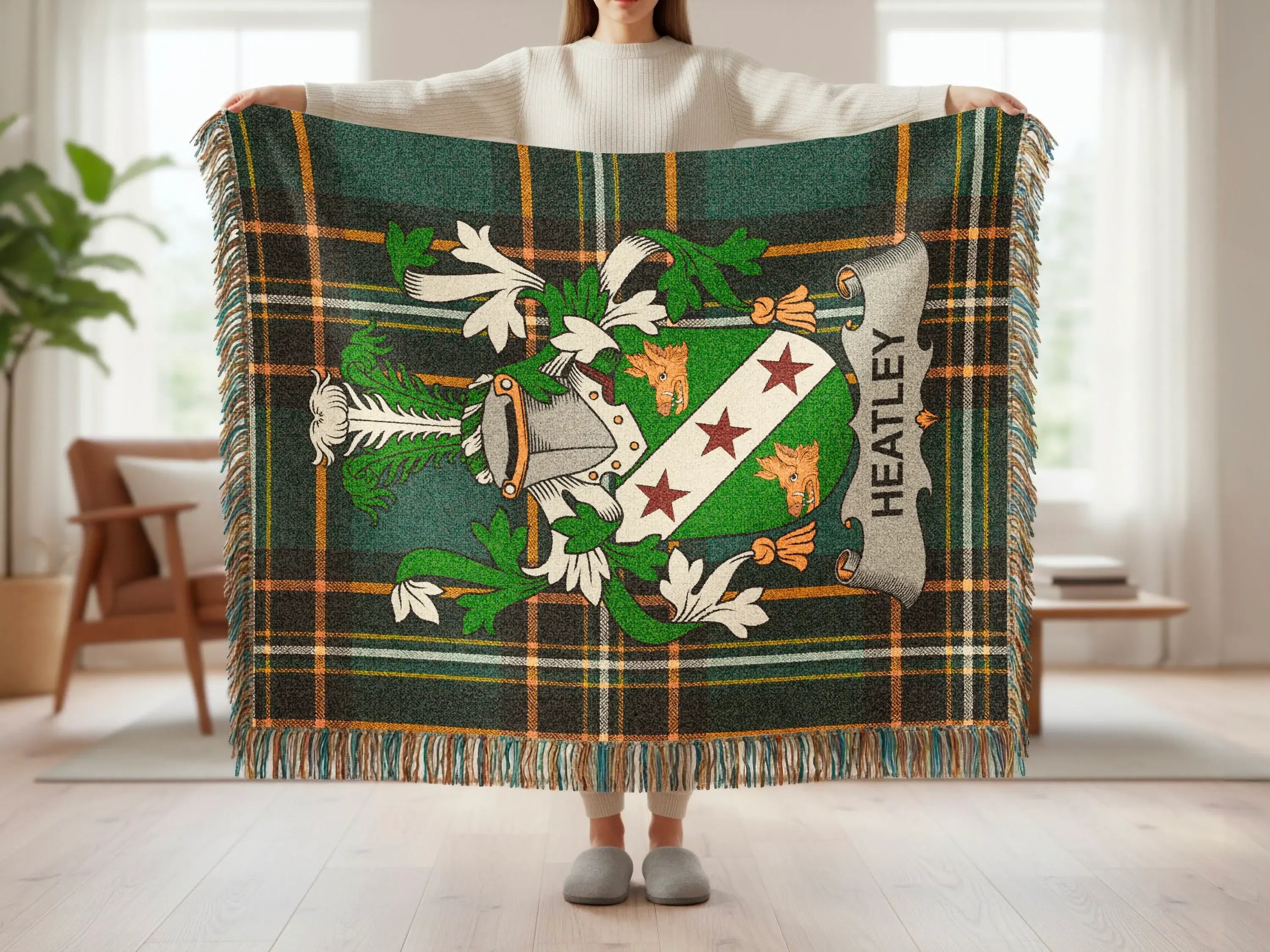 Green tartan blanket with shield crest and "Heatley" text.