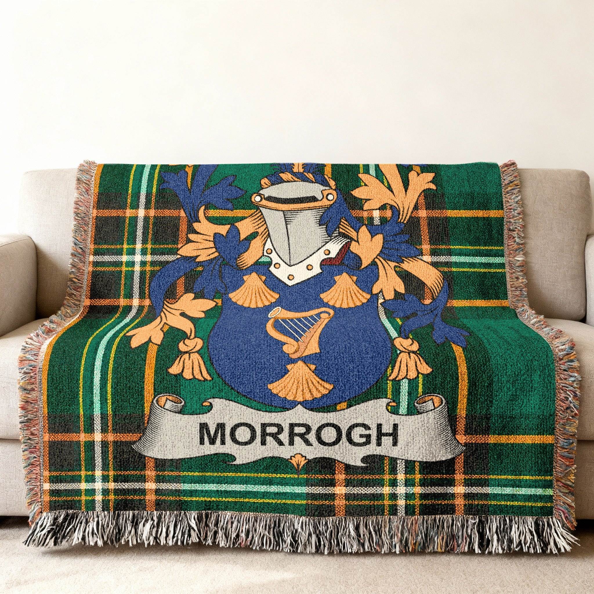 Tartan throw blanket with a blue and gold coat of arms and "MORROGH" banner.