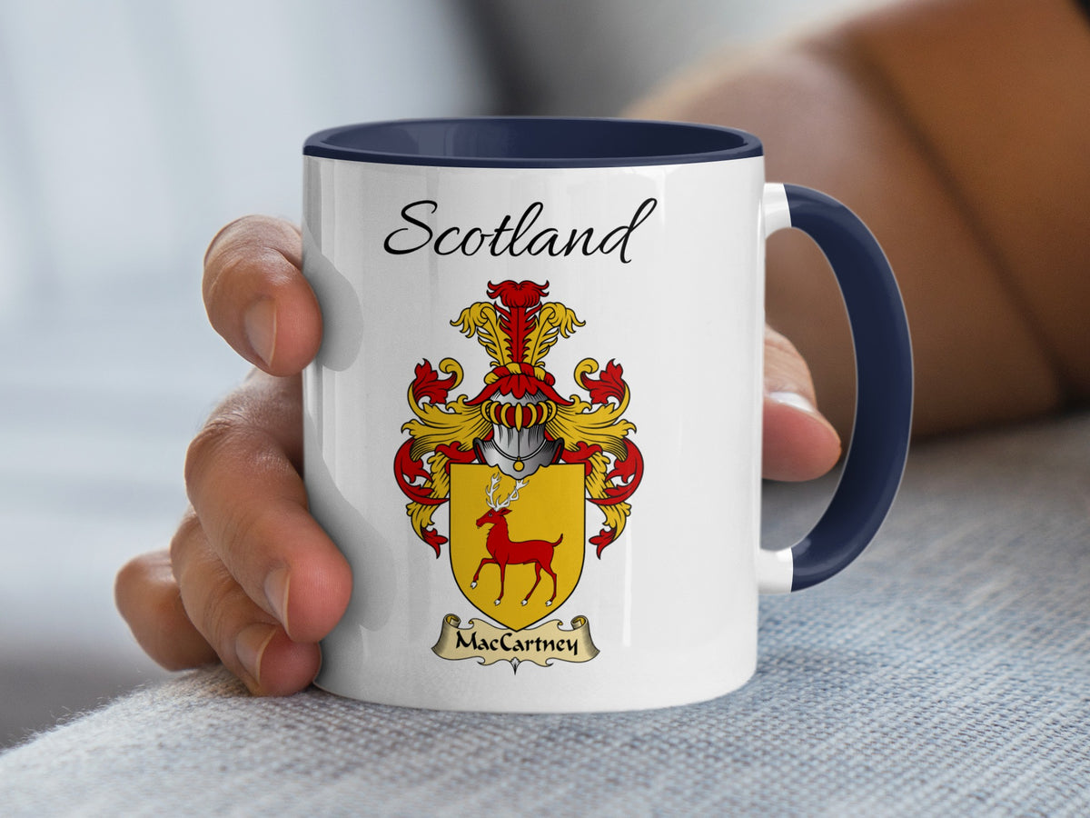 White MacCartney family emblem mug with navy handle and interior, Scotland text and double-sided artwork