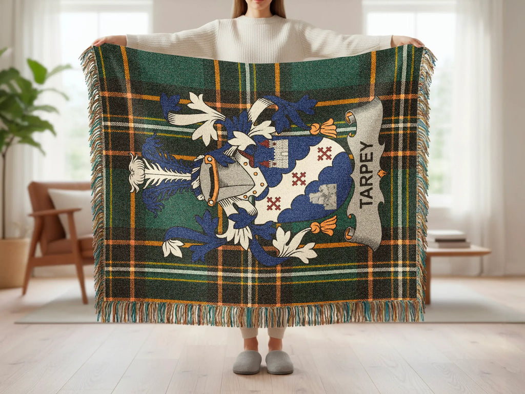 Tartan blanket with a blue and white crest and "TARPEY" banner.
