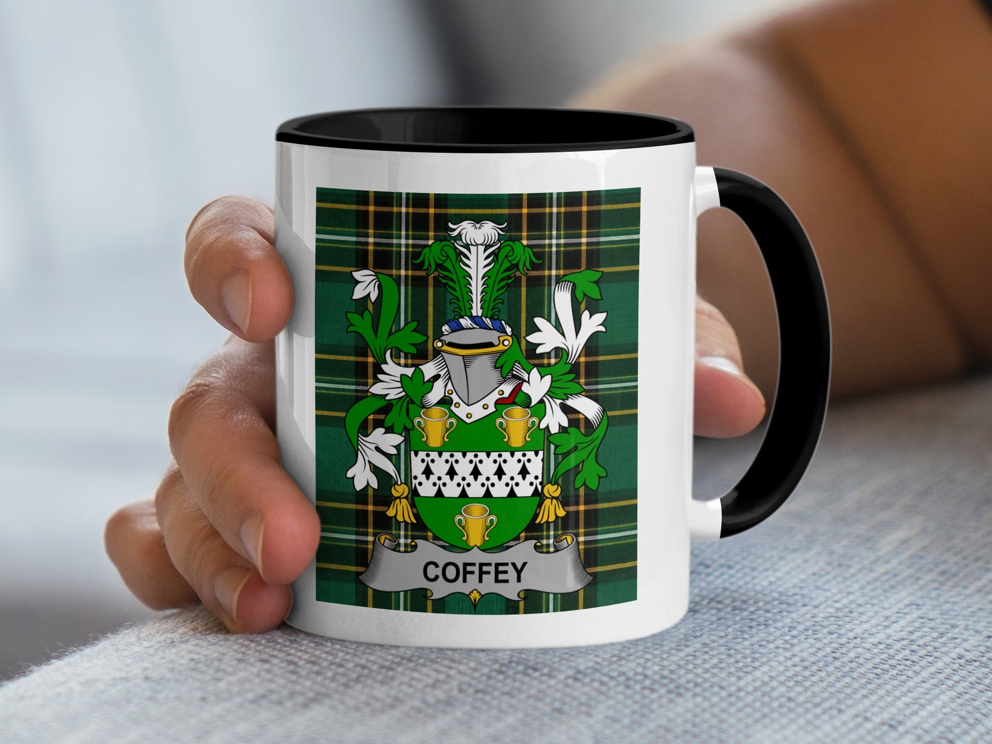 Mug with Coffey family crest, green and white plaid background.