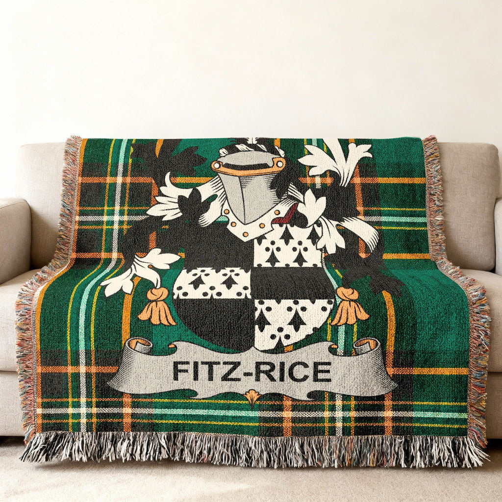 Fitz-Rice family crest on a plaid throw blanket draped over a sofa.