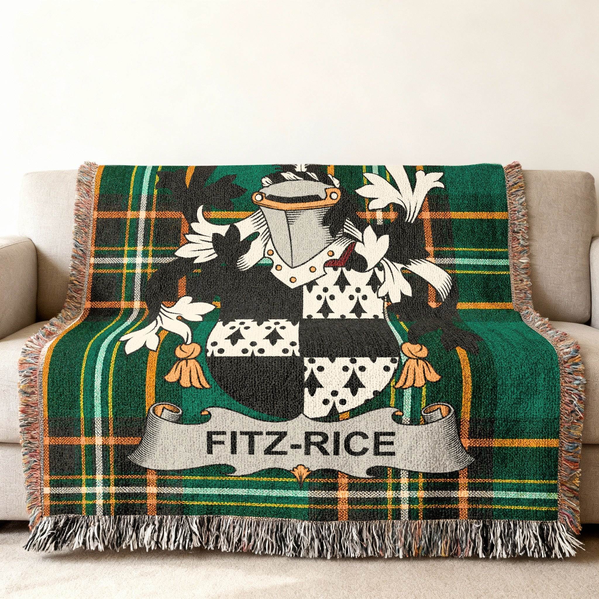 Fitz-Rice family crest on a plaid throw blanket draped over a sofa.