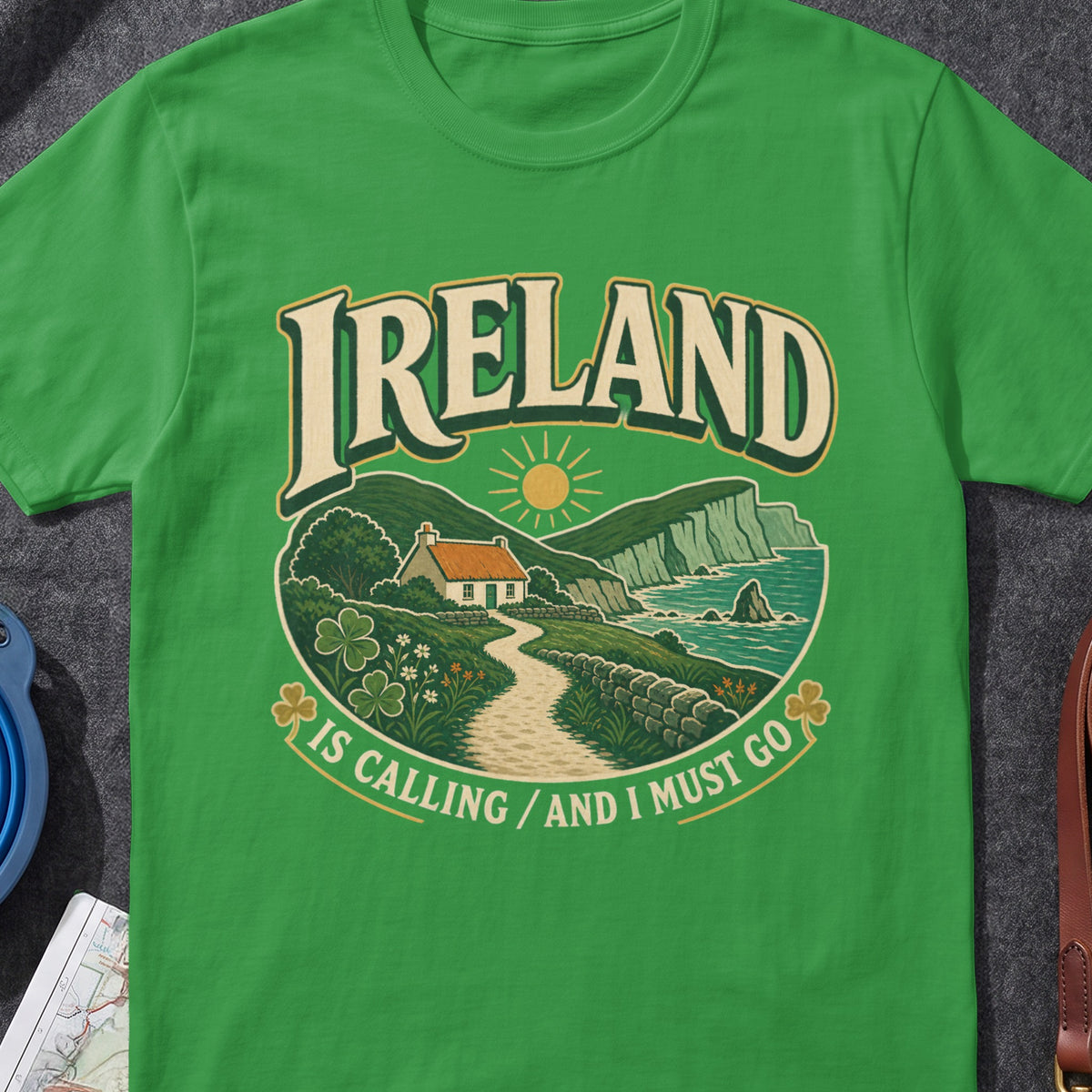 Ireland Is Calling And I Must Go funny Irish T-shirt in Irish Green, flat-lay mockup