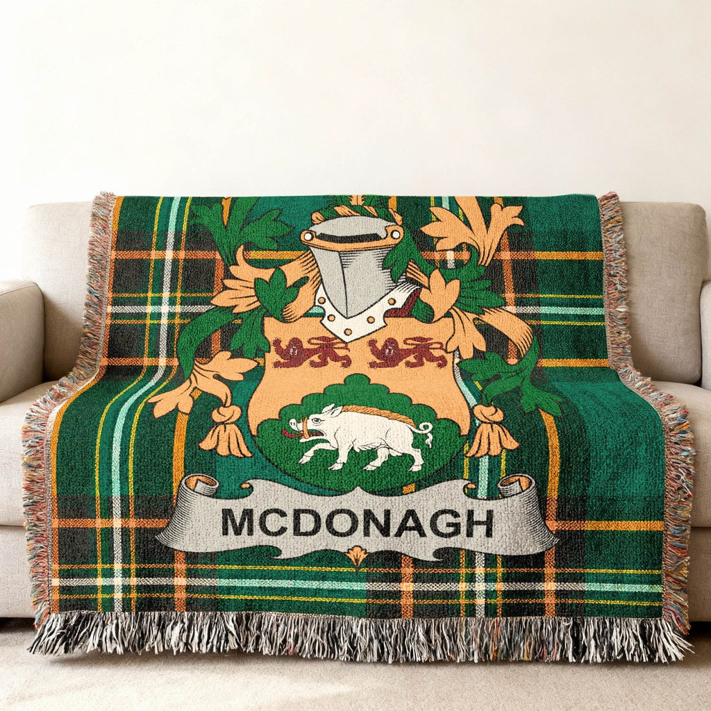 Green tartan blanket with McDonagh coat of arms.