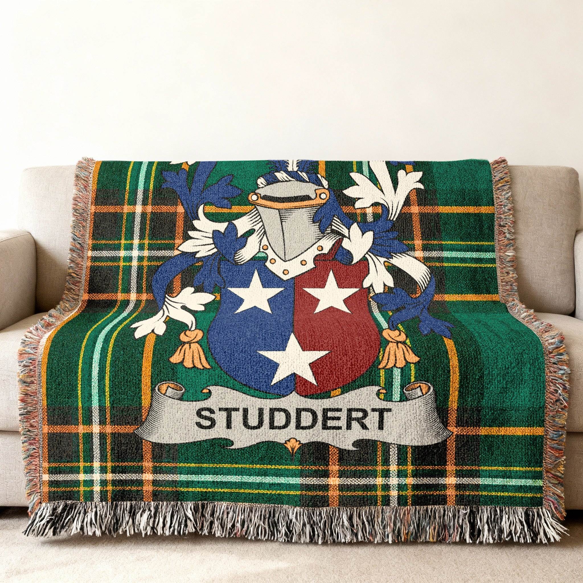 Green plaid blanket with the Studdert family crest in the center.