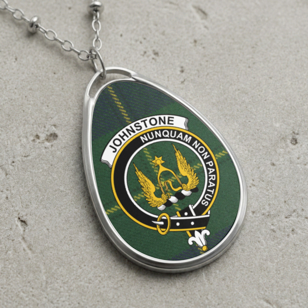 Johnstone clan Scottish tartan necklace with clan crest and Nunquam Non Paratus motto on tartan background