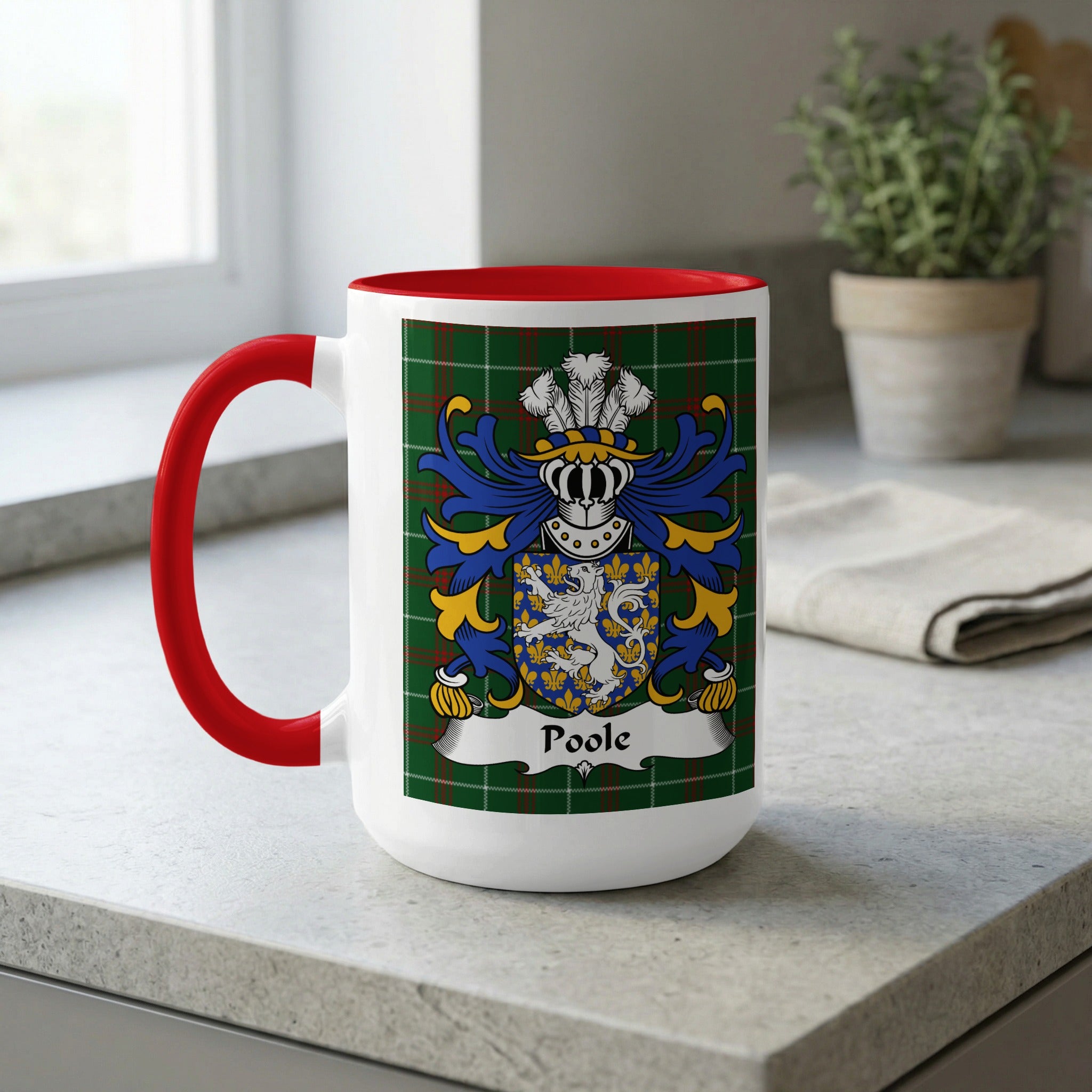 White mug with red handle features a family crest and the name "Poole".