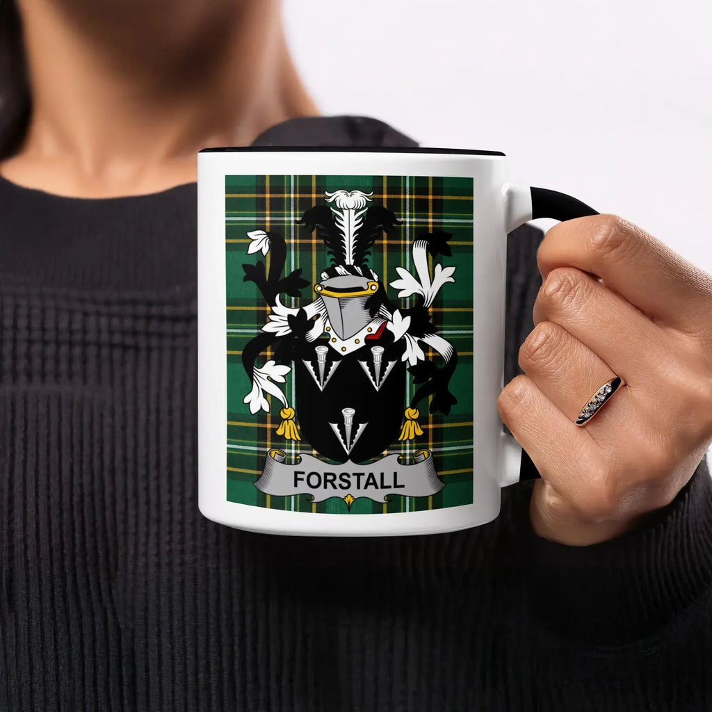 Mug with black handle displaying a Forstall family crest on green tartan.