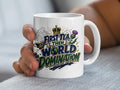 White mug with "First Tea, Then World Domination" and Scottish thistle design.