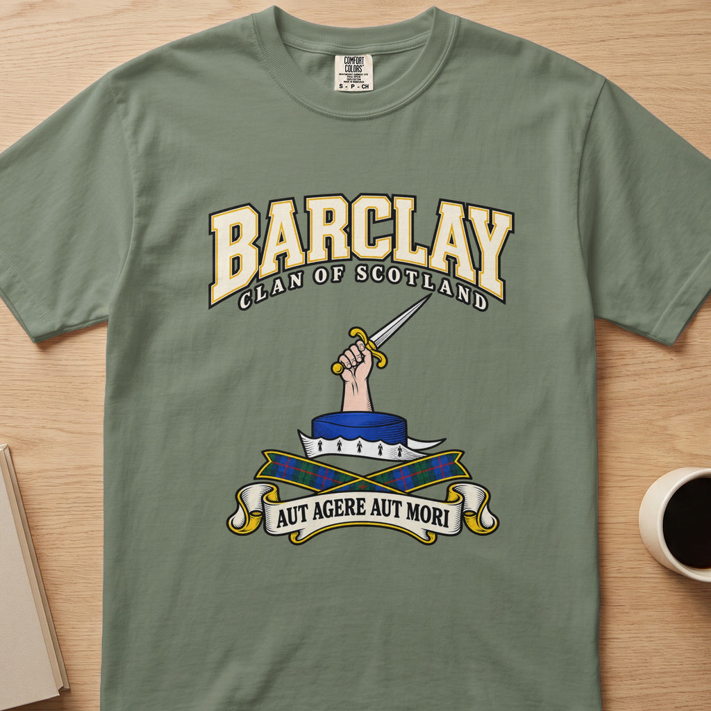 Barclay clan crest with hand holding a sword on a sage green Comfort Colors T-shirt, front view