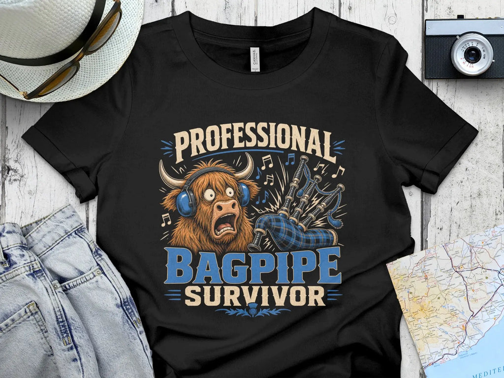 Black t-shirt with "PROFESSIONAL BAGPIPE SURVIVOR" text and a Highland cow illustration.