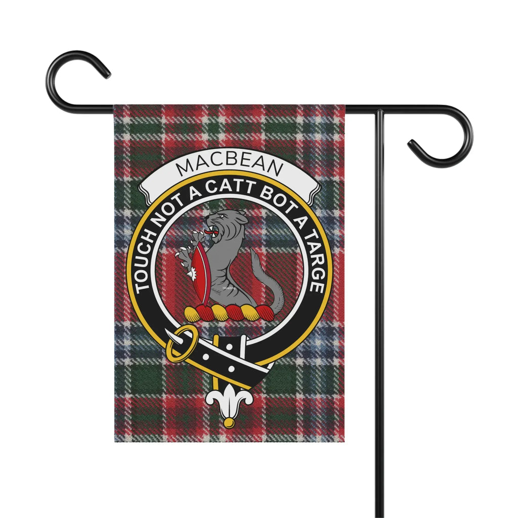 Macbean clan crest with motto "Touch not a catt bot a targe" on tartan background.