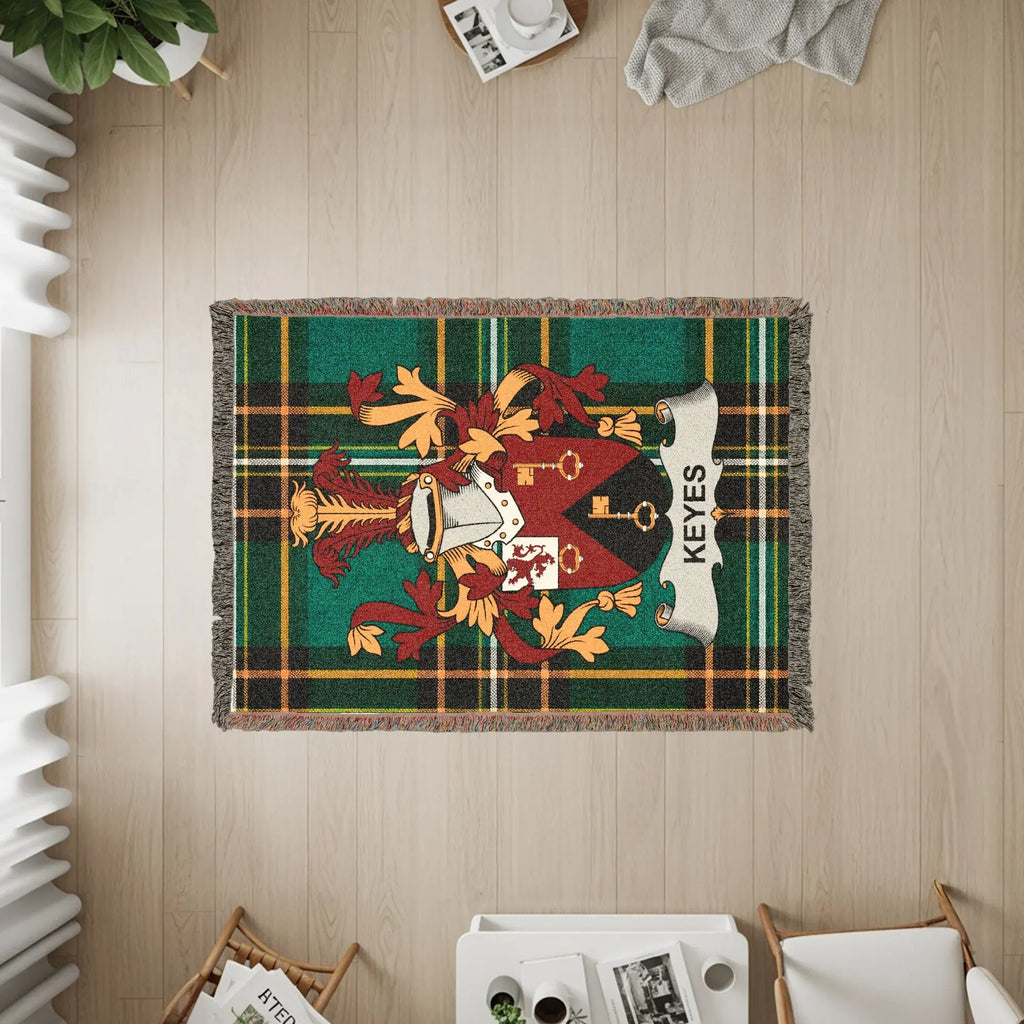 Keyes family crest woven blanket on wooden floor.