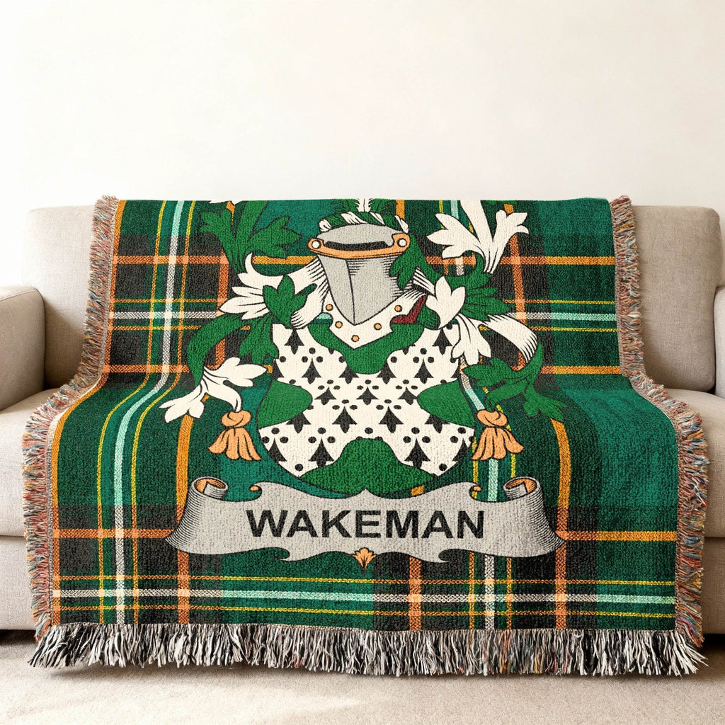 Green tartan throw blanket with Wakeman family crest and name banner.