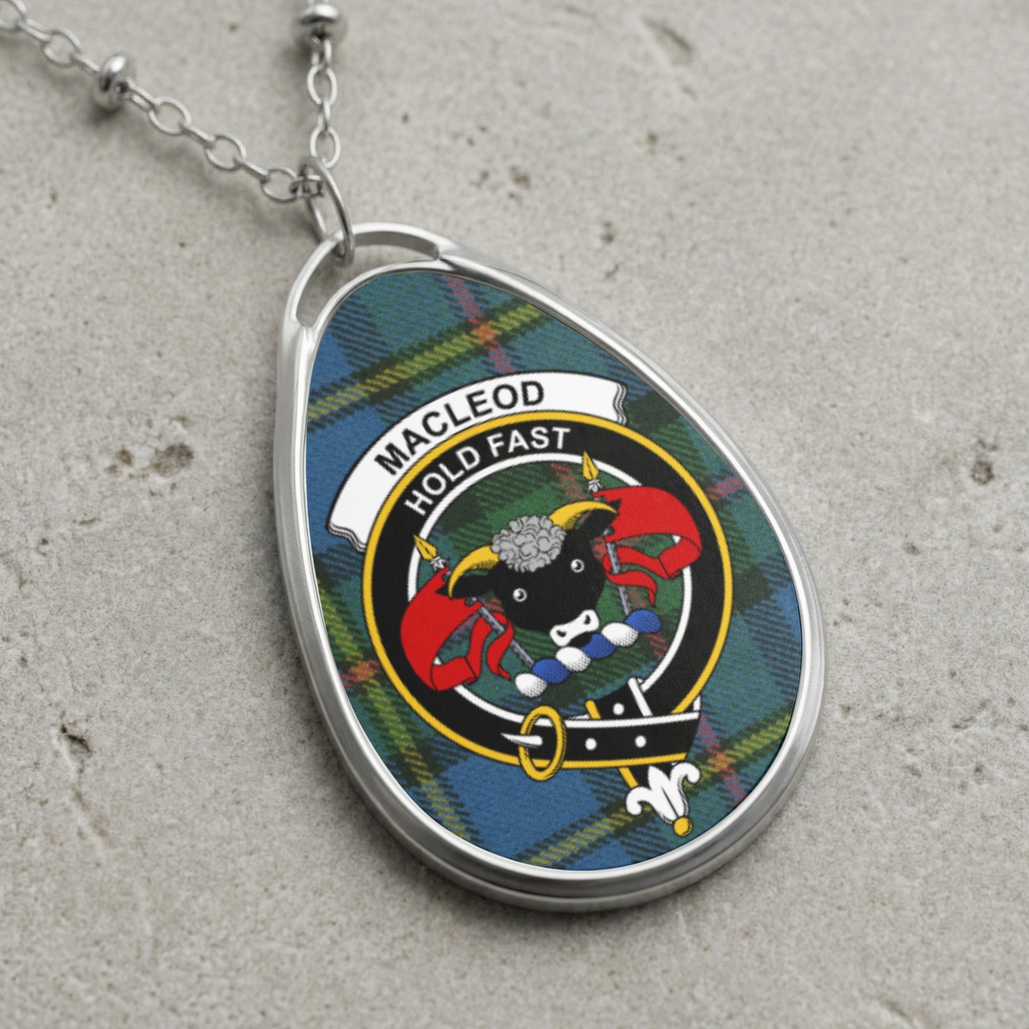 Macleod Hold Fast tartan oval pendant necklace with a ram's head crest.