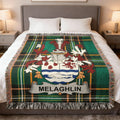 Melaughlin tartan blanket draped on a bed with a family crest.