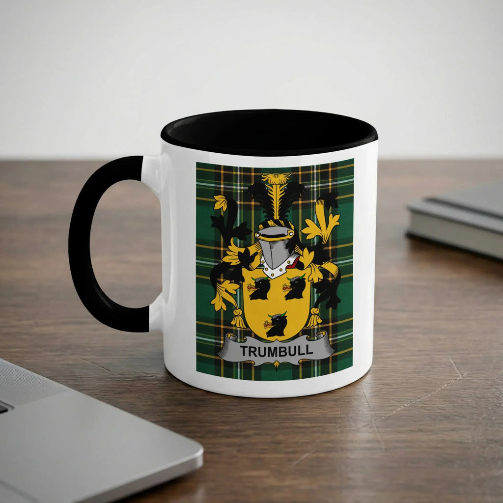 White mug with black rim featuring Trumbull coat of arms on a plaid background.