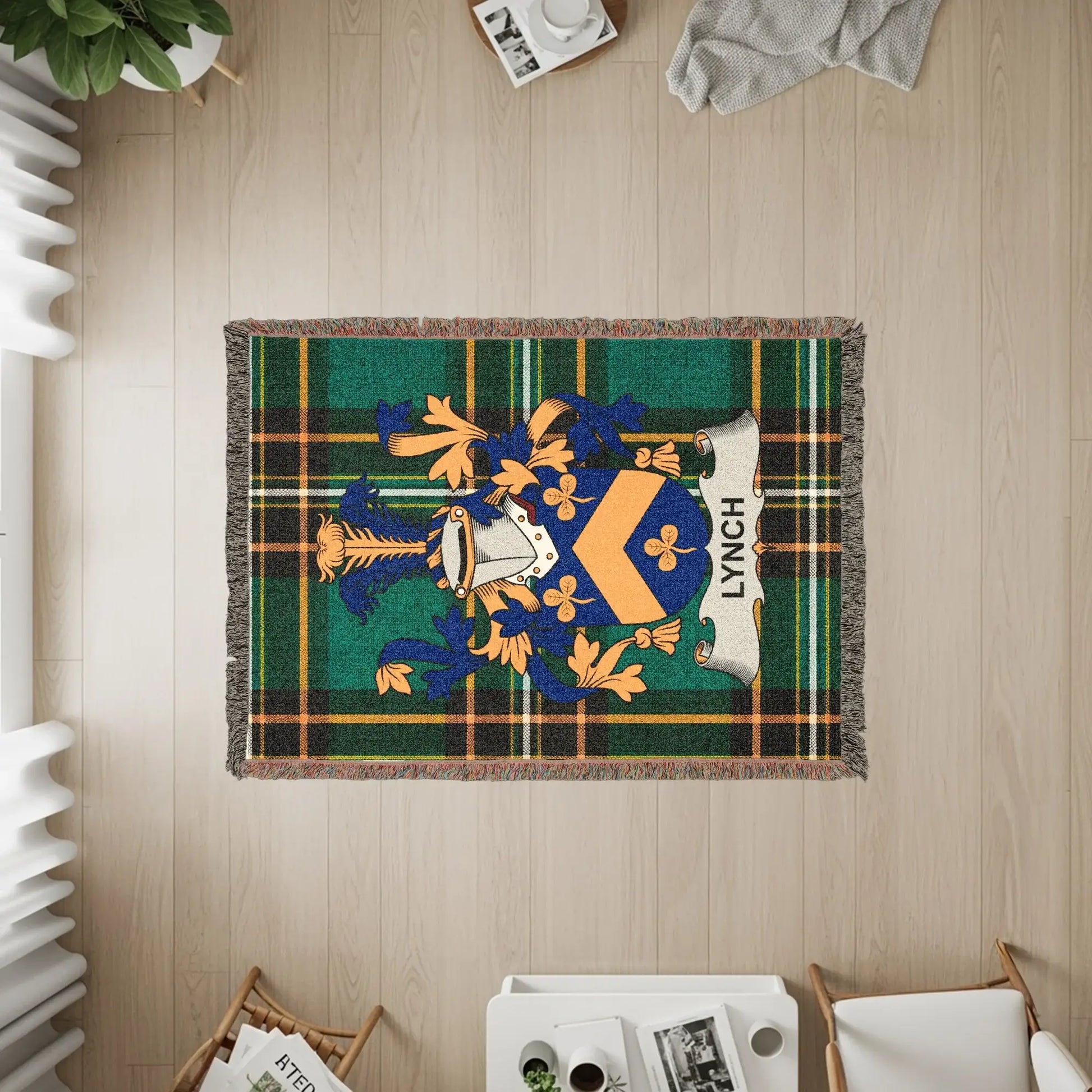 Tapestry throw blanket with Lynch family crest on green and blue plaid.