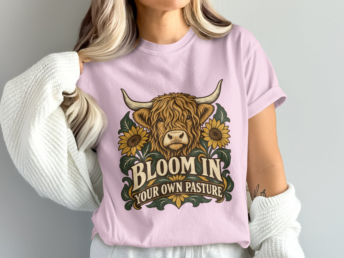 Model wearing the Bloom in Your Own Pasture Highland cow Comfort Colors T-shirt in Blossom