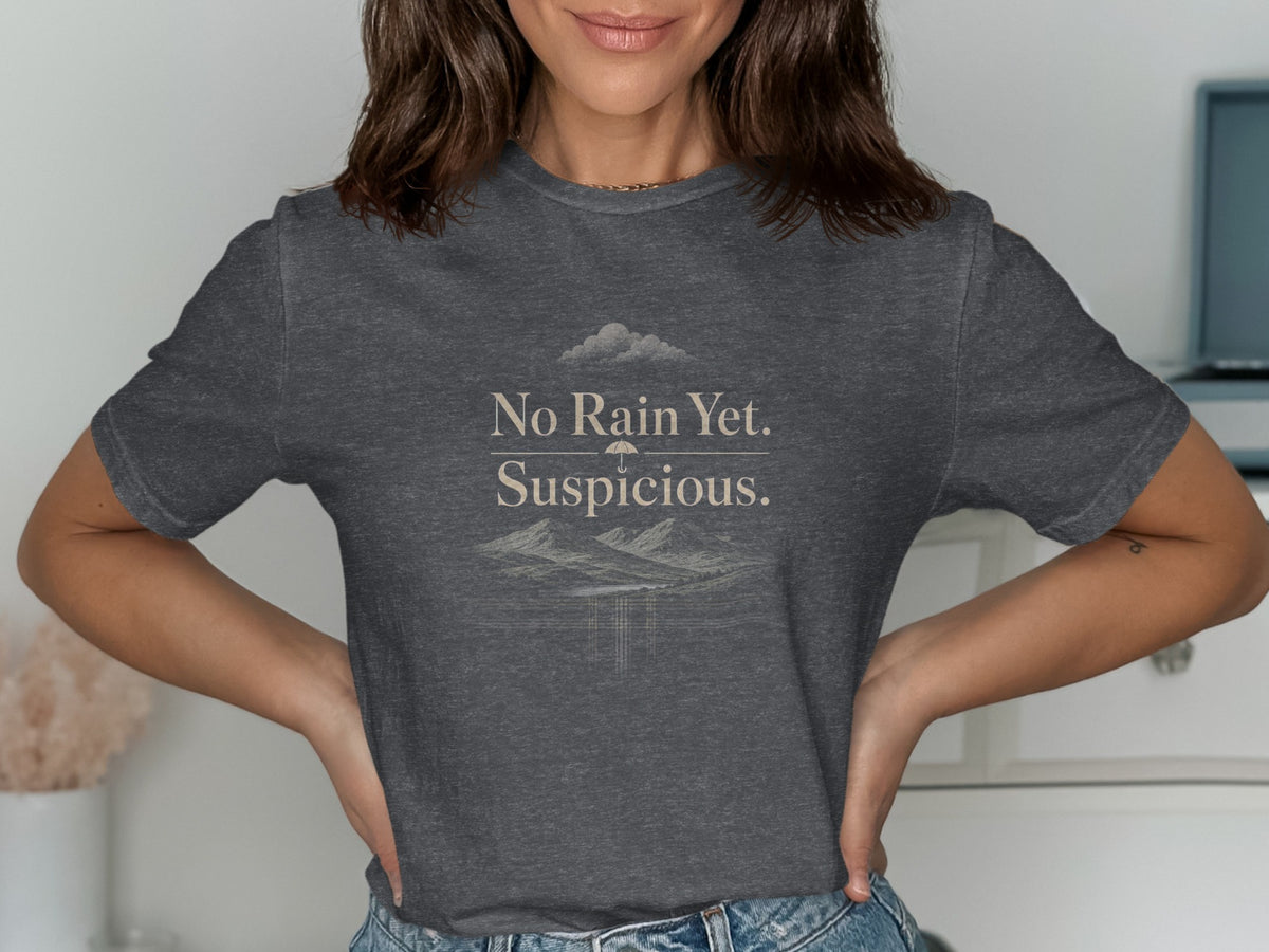 Dark gray t-shirt with "No Rain Yet. Suspicious." and a landscape graphic.
