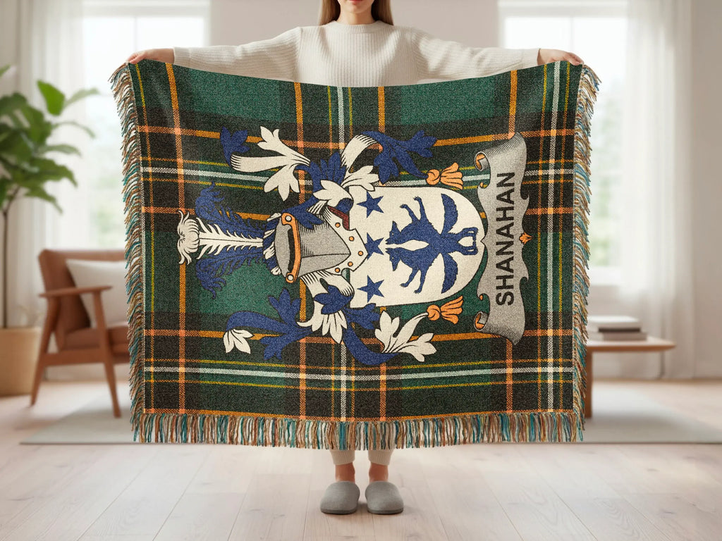 Tartan blanket featuring the Shanahan coat of arms with blue and white heraldry.